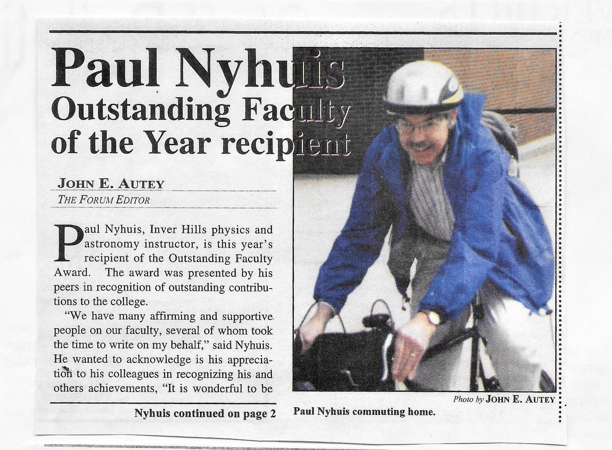 A newspaper article with picture of Paul on a bike